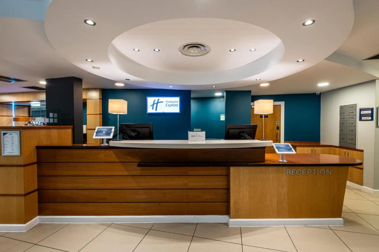 Reception desk in the lobby of Holiday Inn Express Glasgow City Riverside