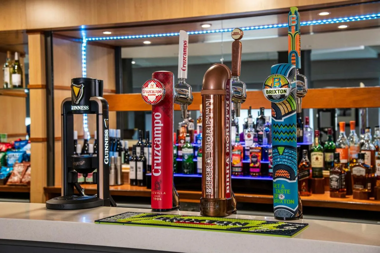 Bar shelving with drinks near the reception area